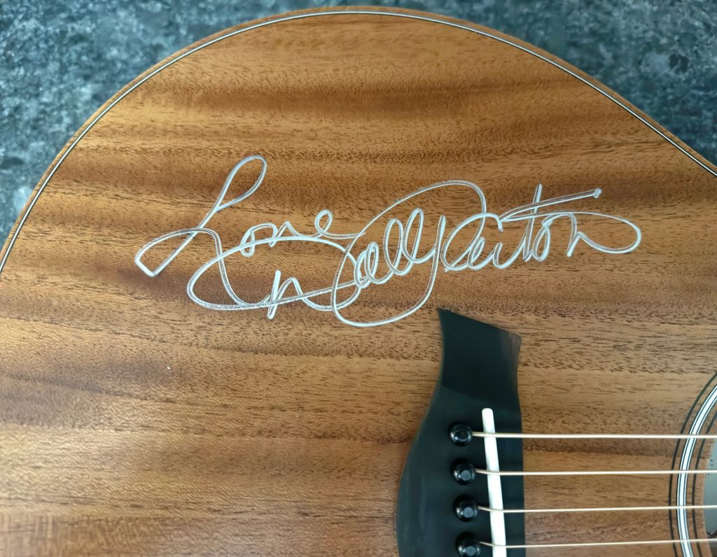 Dolly signed guitar